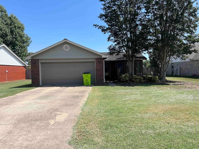 ranch-style house featuring a garage and a front lawn