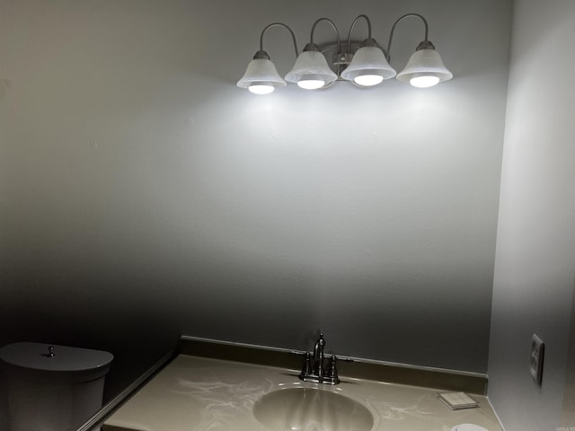 bathroom featuring a sink and toilet
