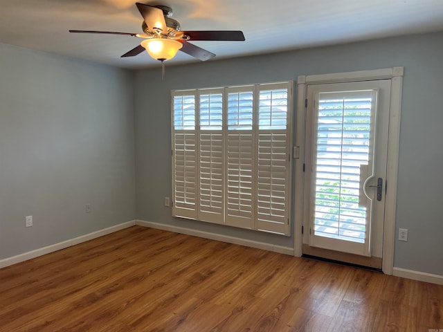 unfurnished room featuring ceiling fan and hardwood / wood-style flooring