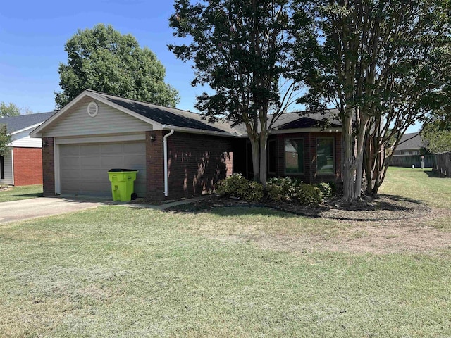 single story home with an attached garage, concrete driveway, a front yard, and brick siding