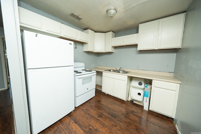 kitchen featuring white appliances, white cabinets, and dark hardwood / wood-style floors