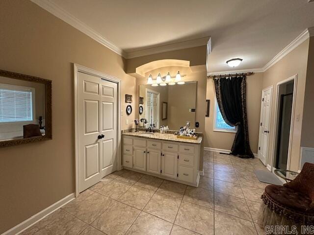 bathroom with tile patterned flooring, crown molding, and vanity