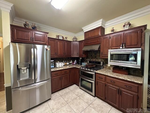 kitchen with light stone countertops, light tile patterned floors, backsplash, appliances with stainless steel finishes, and ornamental molding