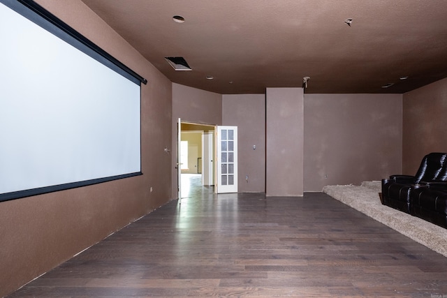 cinema featuring dark hardwood / wood-style floors