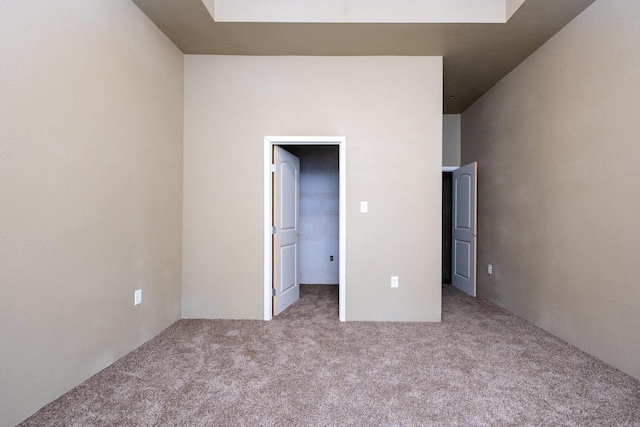 unfurnished bedroom with light carpet