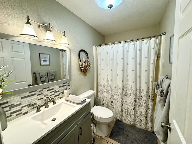 bathroom featuring tile patterned flooring, toilet, backsplash, and a textured ceiling