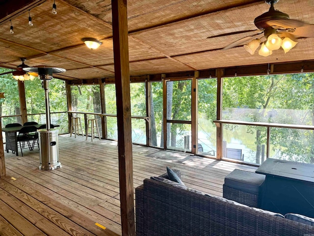 sunroom / solarium with ceiling fan