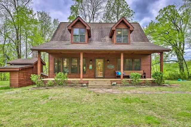 view of front facade featuring a front lawn and covered porch