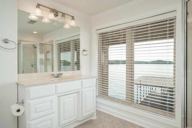 bathroom with tile patterned flooring, an enclosed shower, crown molding, and vanity