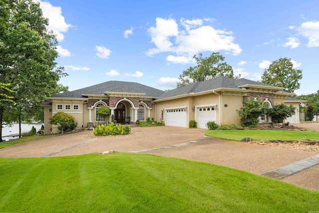 view of front facade featuring a garage and a front lawn