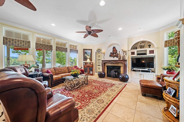 tiled living room featuring a healthy amount of sunlight, ceiling fan, and ornamental molding