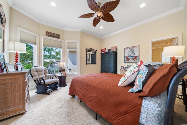 bedroom with crown molding, ceiling fan, and carpet floors