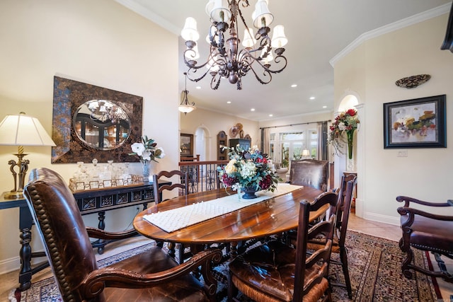 tiled dining space with crown molding and a notable chandelier