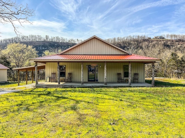 950 Cool Water Retreat, Mountain View, AR 72560 - view of front facade with a front yard, a metal roof, and board and batten siding