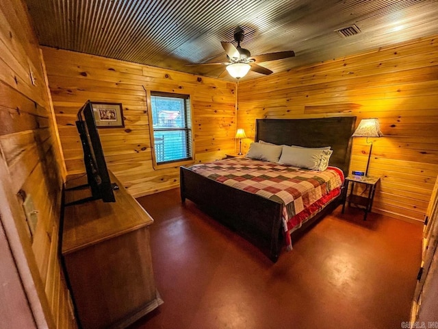 bedroom featuring wood walls, ceiling fan, concrete flooring, and wooden ceiling