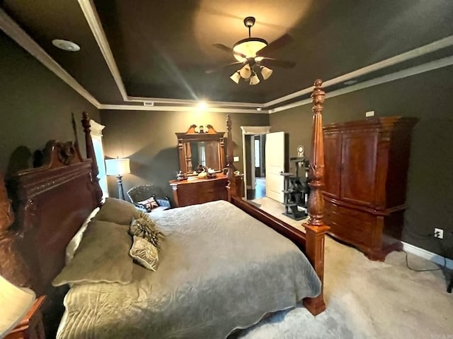 bedroom with ornamental molding, light colored carpet, and ceiling fan