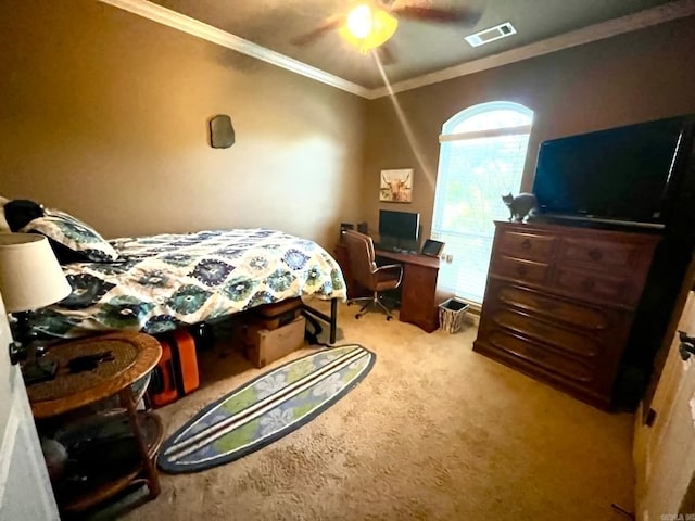 bedroom featuring ceiling fan, crown molding, and light colored carpet