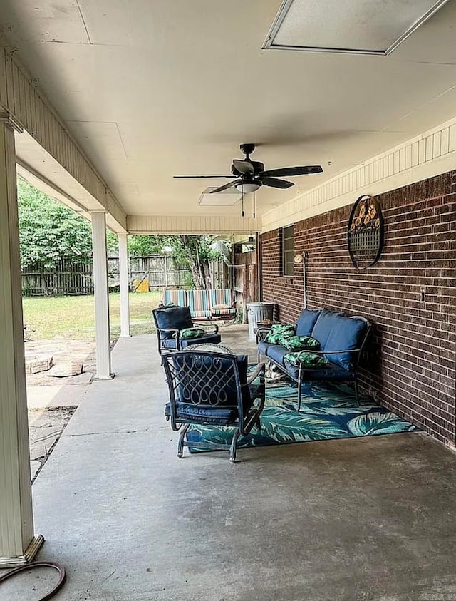 view of patio / terrace with an outdoor living space and ceiling fan