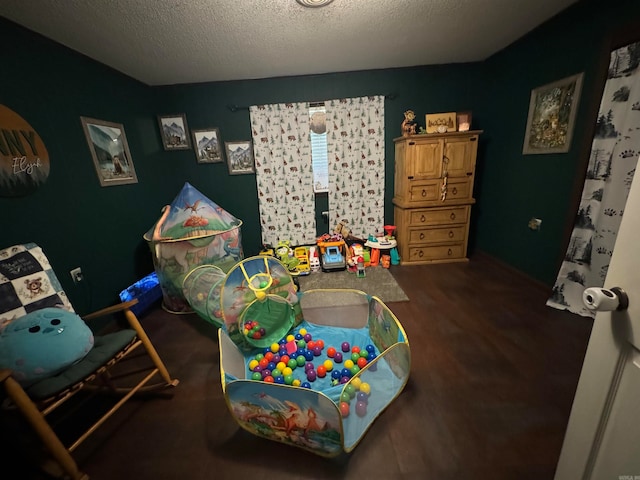 rec room featuring a textured ceiling