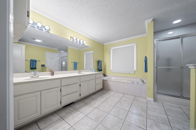 full bath featuring a sink, a shower stall, crown molding, double vanity, and tile patterned flooring