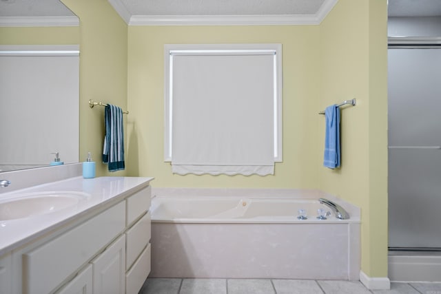 full bathroom featuring a garden tub, tile patterned flooring, ornamental molding, vanity, and a stall shower
