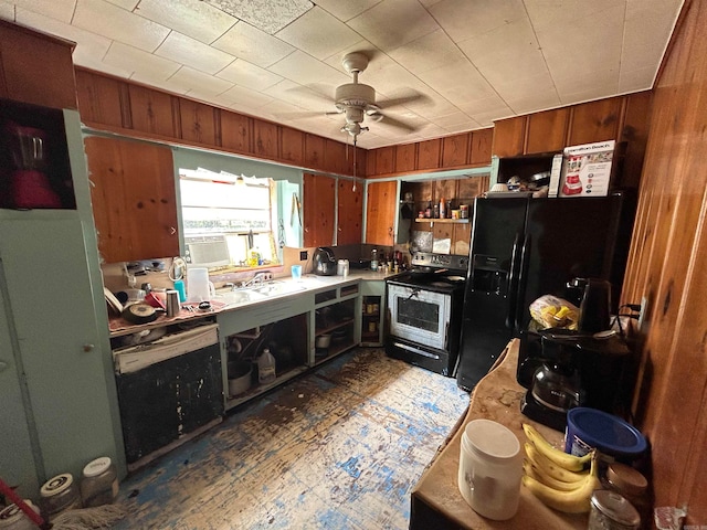 kitchen featuring cooling unit, wooden walls, sink, black appliances, and ceiling fan