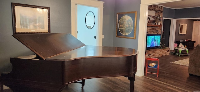 bar featuring crown molding and hardwood / wood-style flooring