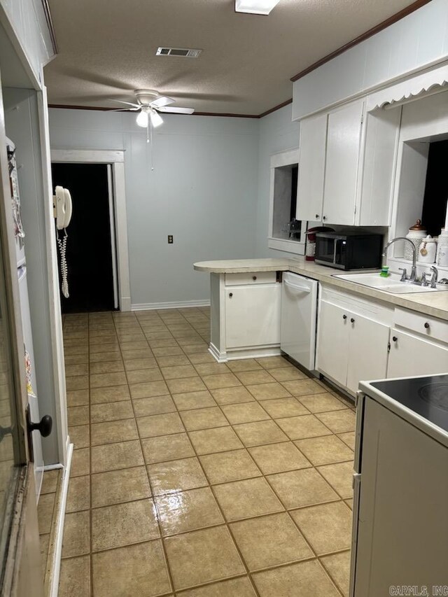 kitchen with white cabinets, dishwashing machine, sink, kitchen peninsula, and ceiling fan