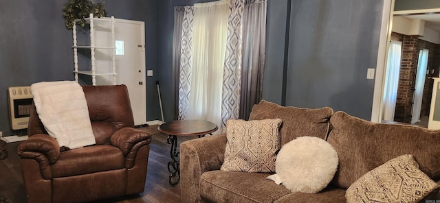 living room featuring wood-type flooring and heating unit