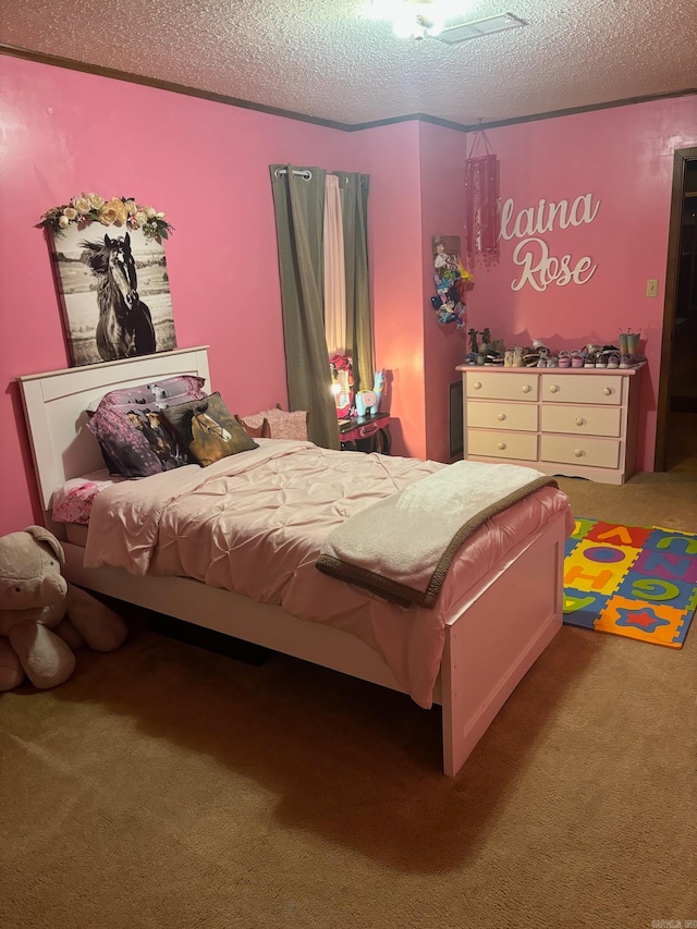 carpeted bedroom with a textured ceiling