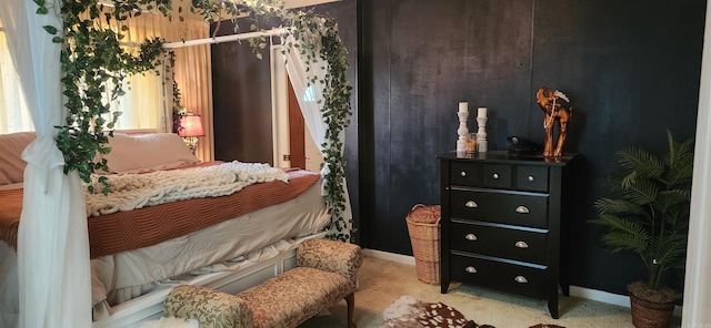 carpeted bedroom with baseboards