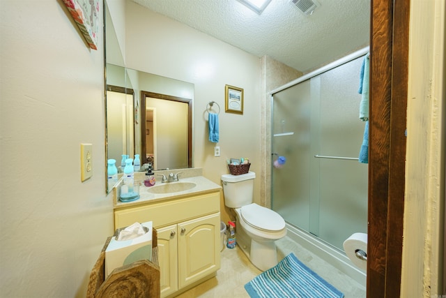 bathroom featuring walk in shower, toilet, a textured ceiling, and vanity