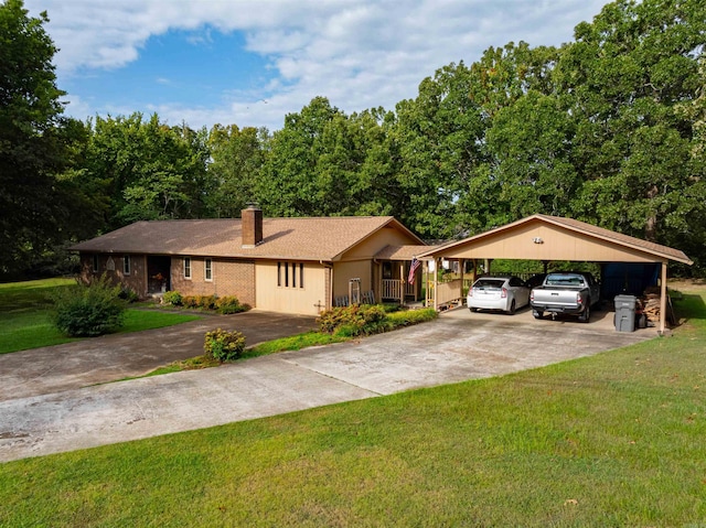 ranch-style home featuring a front yard and a carport