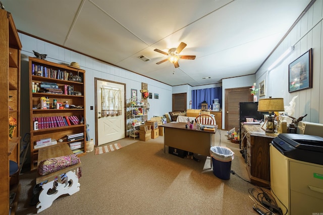 carpeted home office with ceiling fan