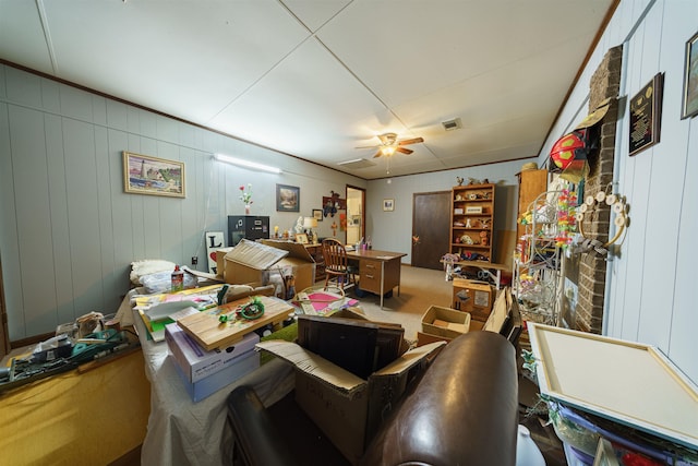 interior space featuring ceiling fan and carpet