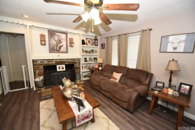 living room with ceiling fan, built in features, and dark hardwood / wood-style flooring