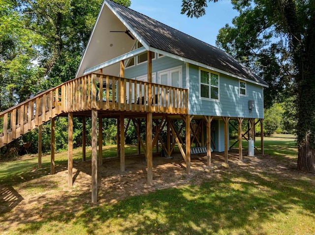 rear view of property with a lawn