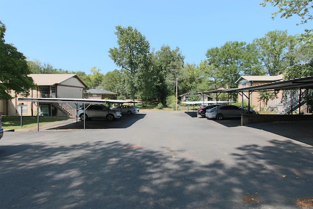 view of vehicle parking with a carport