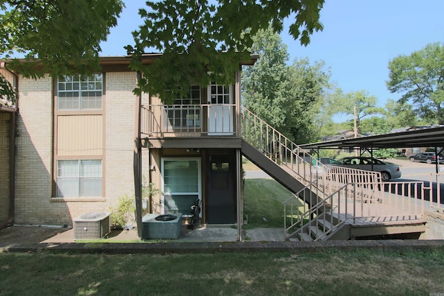 back of house with central air condition unit