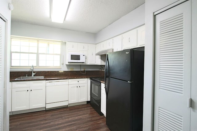 kitchen featuring dark hardwood / wood-style flooring, white cabinetry, sink, black appliances, and a textured ceiling