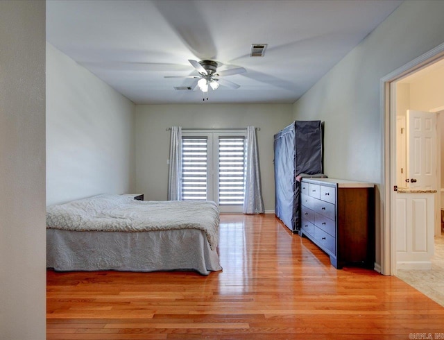 bedroom featuring hardwood / wood-style floors and ceiling fan