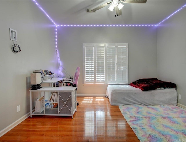 bedroom featuring ceiling fan and hardwood / wood-style floors