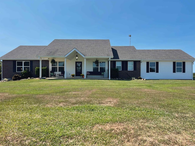 single story home featuring a front yard