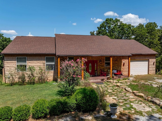 ranch-style house with a garage and a front yard