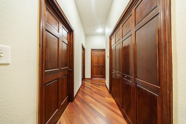 corridor featuring hardwood / wood-style flooring