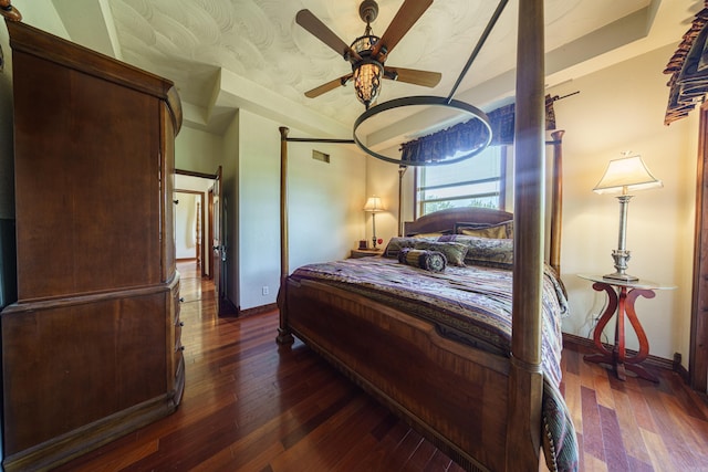 bedroom featuring ceiling fan and dark hardwood / wood-style flooring