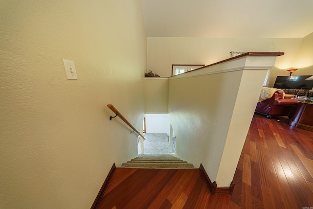 staircase featuring hardwood / wood-style floors