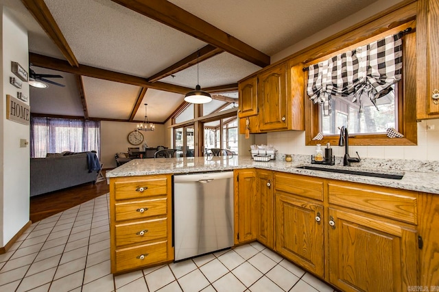 kitchen featuring dishwasher, kitchen peninsula, and a healthy amount of sunlight