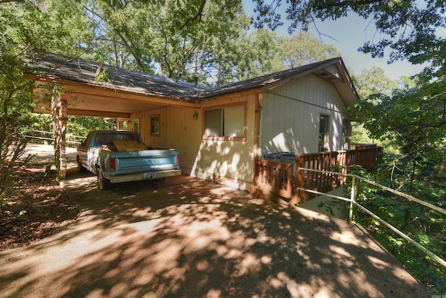 view of home's exterior with a carport