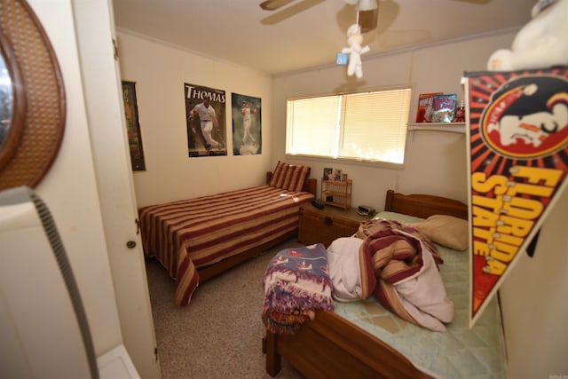 bedroom featuring ceiling fan, carpet, and ornamental molding